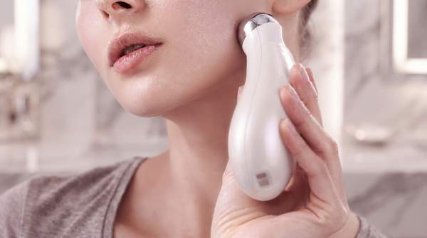 Editorial illustration for At-Home Beauty Devices Compared: What the Evidence Actually Says Before You Buy